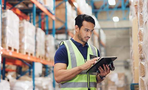 Logistics, man and tablet in warehouse with scanner